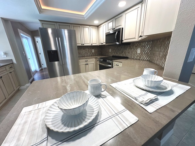 COMPLETELY RENOVATED FOUR BEDROOM TWO BATH POOL HOME